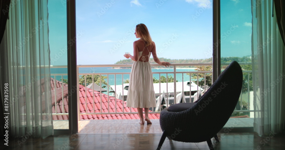 Wall mural tourist female have morning coffee on balcony terrace exotic resort hotel enjoy ocean view. elegant 