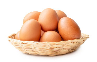 Front view of brown chicken eggs in stack in wicker basket isolated on white background with clipping path