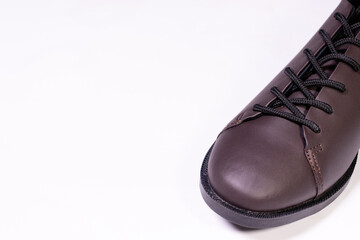 Brown leather shoe isolated on white background. After edits.