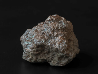 Closeup pure gold nugget from the mine on black background.   Finance and business concept.