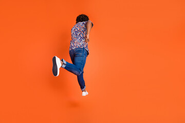 Full body photo of attractive young man running back view dressed stylish colorful clothes isolated...