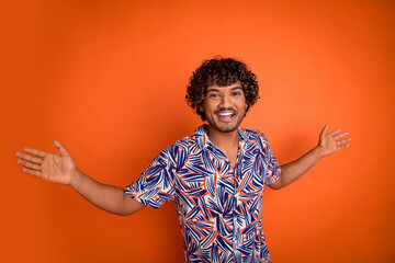 Photo portrait of handsome young man dance enjoy music dressed stylish colorful garment isolated on orange color background