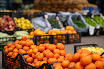 Mandarins in the plastic crate at the market.
