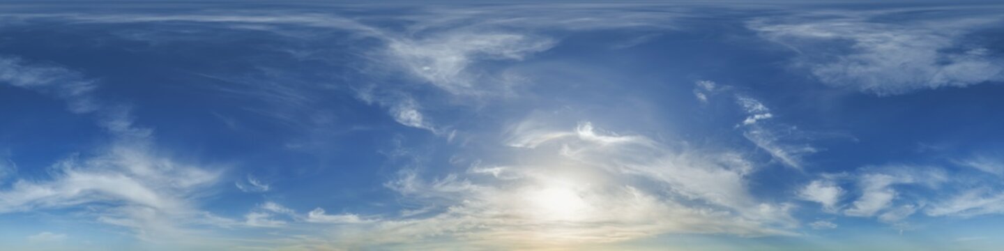 blue evening sky with haze in 360 hdri panorama in equirectangular format with clouds before sunset for use in 3d graphics or game development as skydome or edit drone panoramas or sky replacement