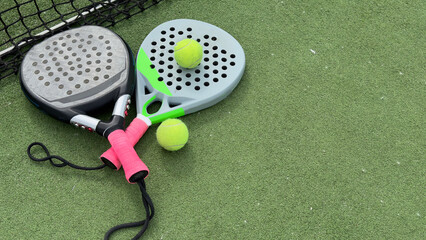 Paddle tennis objects on grass court