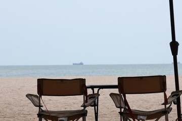 table and chairs on the beach