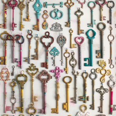 A whimsical assortment of colorful antique keys, each with its own unique design and story, arranged in a charming pattern on a soft background. Seamless pattern wallpaper background.