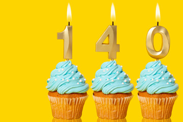Birthday Cupcakes With Candles Lit Forming The Number 140