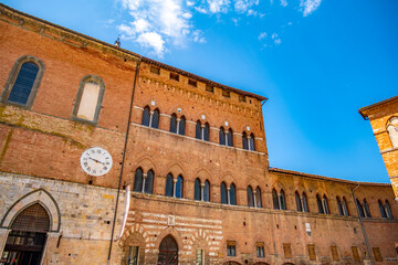 Fototapeta premium Siena, medieval town in Tuscany, with view of the Dome & Bell Tower of Siena Cathedral, Mangia Tower and Basilica of San Domenico, Italy