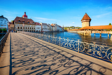 Lucerne city, Switzerland, view of the historical Old town and famous wooden Chapel Bridge in the sunset light