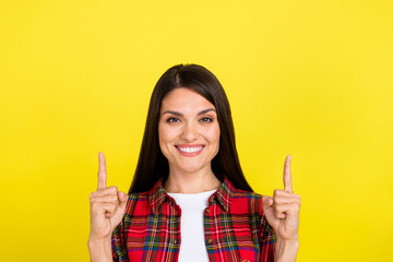 Photo of shiny attractive lady dressed checkered shirt showing two fingers up empty space isolated...