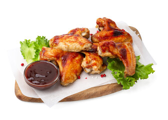Board with marinade, chicken wings, spices and lettuce isolated on white