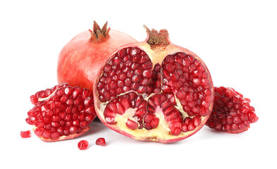 Cut and whole pomegranates isolated on white