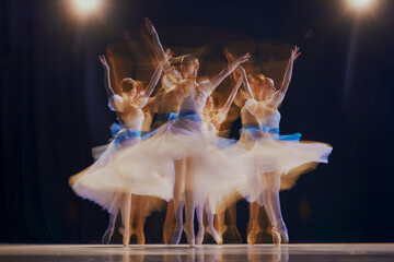 Dancing ballerinas in airy costumes, creating a sense of weightlessness and fluid movements. Photo...
