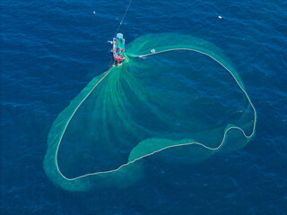 Aerial view of traditional wooden boat and fishermen are fishing anchovies in Yen Island, Phu Yen province, Vietnam
