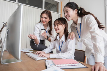 A group of Asian businesswomen in a conference room are discussing ways of working and improving...