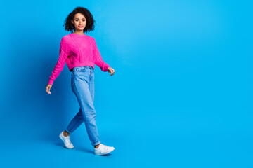 Obraz premium Full size photo of pretty young girl walk shopping wear trendy pink outfit isolated on blue color background