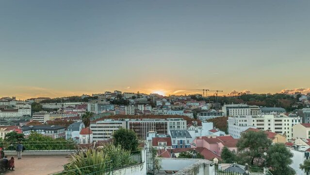 Panorama showing Jardim do Torel timelapse, a traditional garden and viewpoint with unusual views to the city center of Lisbon during sunset. It has a terrace, a bar and a large pond. Portugal