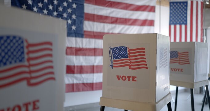 Wide view, row of voting booths at polling station in United States. US flag on back wall