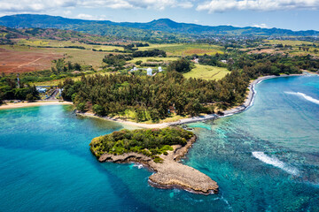 Aerial panoramic of waves of Indian Ocean and turquoise coral reef, Poste Lafayette, East coast,...