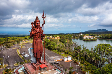 Shiva Statue, 33 m tall Hindu god, standing at the entrance of Ganga Talao - Grand Bassin lake the...