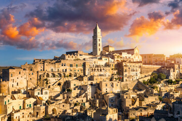 Fototapeta premium Panoramic view of the ancient town of Matera (Sassi di Matera) in a beautiful autumn day, Basilicata, southern Italy. Stunning view of the village of Matera. Matera is a city on a rocky outcrop.