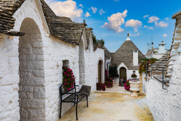 The traditional Trulli houses in Alberobello city, Apulia, Italy. Cityscape over the traditional...