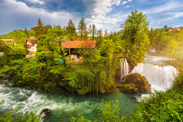 Village of Rastoke near Slunj in Croatia, old water mills on waterfalls of Korana river, beautiful countryside landscape. Landscape with river and little waterfalls in Rastoke village, Croatia.