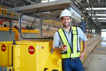 engineer or worker smiling and thumbs up pose with a car in the factory