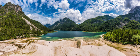 View to Julian Alps mountains above Predil lake in Italy with small lake. Predil Lake, Friuli Italy...