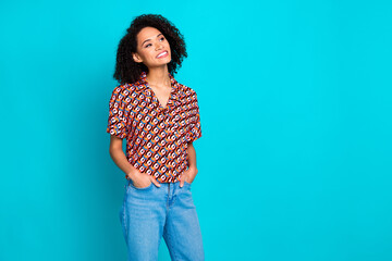 Photo of dreamy lovely lady dressed print shirt smiling looking empty space isolated teal color...