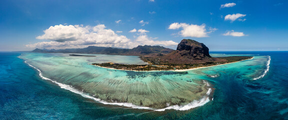 Aerial view of Mauritius island panorama and famous Le Morne Brabant mountain, beautiful blue lagoon and underwater waterfall. Aerial view of Le morne Brabant in Mauriutius.