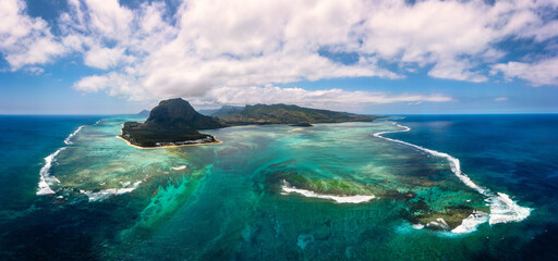 Aerial view of Mauritius island panorama and famous Le Morne Brabant mountain, beautiful blue lagoon and underwater waterfall. Le Morne Brabant peninsula and Underwater Waterfall, Mauritius.