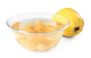 Delicious quince drink in glass bowl and fresh fruit isolated on white
