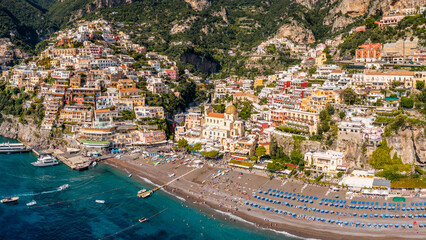 Aerial view of Positano with comfortable beach and blue sea on Amalfi Coast in Campania, Italy....