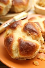 Tasty hot cross buns on table, closeup