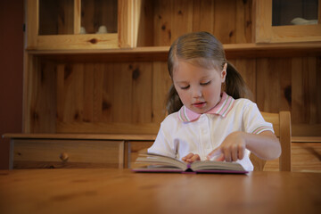 Little Girl Reading A Book