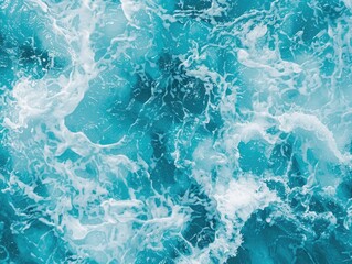 The image is of a blue ocean with white foam and waves. The water appears to be calm, but there is a sense of movement and energy in the waves