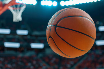 A basketball is in the air, and the crowd is watching the game