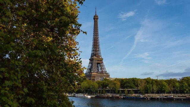 Timelapse of the Eiffel Tower Paris city morning sunrise to daytime Sunny and clear sky riverside bay view bridge.