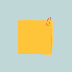 Yellow sticky notes with red paperclip on pastel blue background