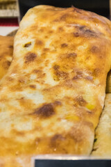 Aromatic khachapuri with chicken and vegetables. Traditional dish of Georgian cuisine