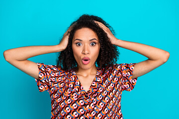 Photo of impressed attractive lady dressed print shirt arms head isolated turquoise color background