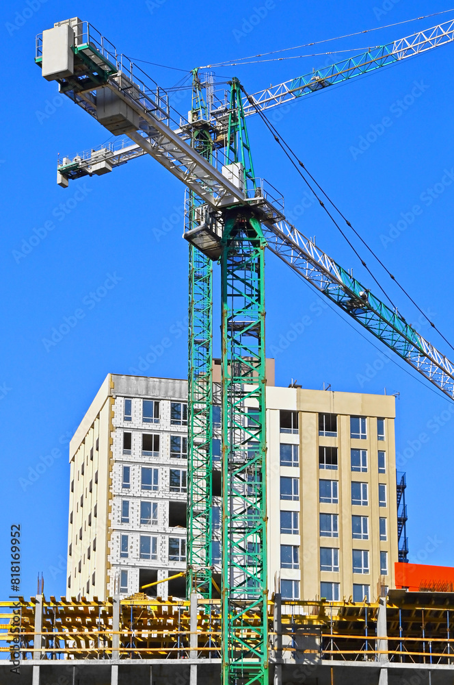 Wall mural Crane and highrise construction