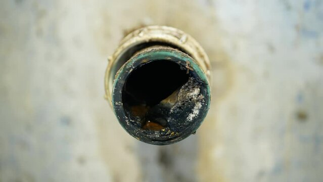 Sewer pipe wash-basin cleaning sink sewage kitchen blockage drain cleaning and septic cesspool pumping siphon into wash leak. The sump flowing contains pollution sludge water black wastewater