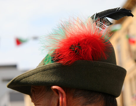 Head of the person wearing a hat with the black feather typical of the uniform of the Alpini mountain troops of the Italian Army