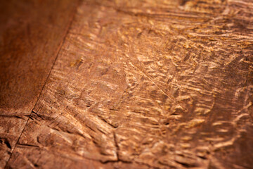 Extreme closeup of crumpled brass foil texture