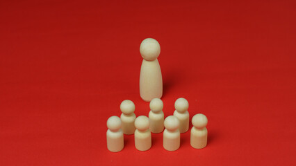 Leader wooden figures with followers lineup in orderly on white background with growth up arrows....