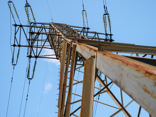 Bottom view over the electric power high voltage transmission line tower in Kyiv, Ukraine. Electric...