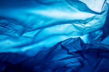 Extreme close up of blue empty plastic bag background.